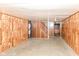 Spacious unfinished basement with exposed ceiling and wood paneling at 3325 Broadview Ct, Indianapolis, IN 46227
