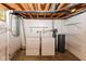 Unfinished basement laundry area with exposed ceiling and some storage at 3325 Broadview Ct, Indianapolis, IN 46227