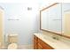 Bathroom with oak vanity, tiled floors, and a standard tub and shower at 3325 Broadview Ct, Indianapolis, IN 46227