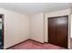 Simple bedroom features closet and neutral-toned walls and pink carpeting at 3325 Broadview Ct, Indianapolis, IN 46227