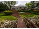 This backyard boasts a walkway, stone, stairs, and multiple levels of landscaping at 3430 Bay Road South Dr, Indianapolis, IN 46240