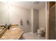 Cozy full bath with granite counters, tile floors, and built-in shower at 3430 Bay Road South Dr, Indianapolis, IN 46240