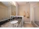 This full bath features a large granite vanity, tile floors, and shower/tub combo at 3430 Bay Road South Dr, Indianapolis, IN 46240