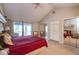 Generous bedroom boasts vaulted ceilings, large windows, closet system and slider to lake view at 3430 Bay Road South Dr, Indianapolis, IN 46240