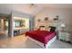 Spacious main bedroom featuring a vaulted ceiling, tiled floor, and adjoining vanity at 3430 Bay Road South Dr, Indianapolis, IN 46240