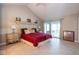 Spacious bedroom with vaulted ceilings and a sunroom entrance at 3430 Bay Road South Dr, Indianapolis, IN 46240