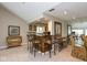 Dining area with a bar, unique seating, and classic decor elements at 3430 Bay Road South Dr, Indianapolis, IN 46240