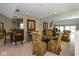 Elegant dining room with a mirrored wall, glass table, and comfortable seating at 3430 Bay Road South Dr, Indianapolis, IN 46240