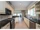 Efficient kitchen layout with ample counter space and modern stainless steel appliances at 3430 Bay Road South Dr, Indianapolis, IN 46240