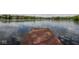 Scenic view of the lake from the wooden dock, providing direct water access at 3430 Bay Road South Dr, Indianapolis, IN 46240