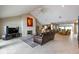Spacious living room with fireplace, open floor plan, and ample natural light at 3430 Bay Road South Dr, Indianapolis, IN 46240