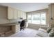 Comfortable office space with a large window and built-in shelving, ideal for working from home at 3430 Bay Road South Dr, Indianapolis, IN 46240