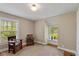 This bedroom features two windows for ample natural light and neutral paint at 3614 Guilford Ave, Indianapolis, IN 46205