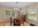 Bright dining area with large windows and hardwood floors at 3614 Guilford Ave, Indianapolis, IN 46205