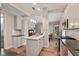 Beautiful kitchen features an island, stainless steel appliances, and white cabinets at 3614 Guilford Ave, Indianapolis, IN 46205