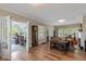 Spacious living room with hardwood floors, neutral walls, and a doorway to a sunroom at 3614 Guilford Ave, Indianapolis, IN 46205