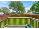 Backyard featuring a lush green lawn, a wooden fence, and a mature tree at 405 N Drexel Ave, Indianapolis, IN 46201