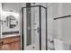 Modern bathroom with glass shower door, tiled walls, granite countertop, and updated fixtures at 405 N Drexel Ave, Indianapolis, IN 46201