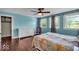 Bedroom with a ceiling fan, a dresser, a bed, and two windows at 405 N Drexel Ave, Indianapolis, IN 46201