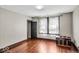 Bedroom with hardwood floors, closet, neutral walls and bright window at 405 N Drexel Ave, Indianapolis, IN 46201