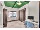 Cozy bedroom with natural light, neutral carpet, and modern ceiling with green trim at 405 N Drexel Ave, Indianapolis, IN 46201