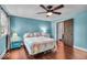 Bedroom featuring light blue walls, ceiling fan, and hardwood floors at 405 N Drexel Ave, Indianapolis, IN 46201