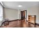 Bedroom featuring hardwood floors, neutral walls, and dark trim at 405 N Drexel Ave, Indianapolis, IN 46201