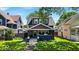 Inviting two-story home with a covered porch and a well-maintained front yard at 405 N Drexel Ave, Indianapolis, IN 46201
