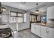 Bright kitchen with granite countertops, white cabinets, and modern pendant lighting at 405 N Drexel Ave, Indianapolis, IN 46201