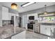 Modern kitchen with granite countertops, stainless steel appliances, and ample cabinet space at 405 N Drexel Ave, Indianapolis, IN 46201