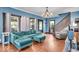 Comfortable living room featuring hardwood floors, large windows, and stylish furniture at 405 N Drexel Ave, Indianapolis, IN 46201