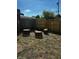 Backyard fire pit area surrounded by tree stump seating and decorative lighting at 426 St Paul St, Indianapolis, IN 46201