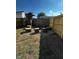 Cozy backyard with a custom fire pit and tree stump seating, perfect for outdoor gatherings at 426 St Paul St, Indianapolis, IN 46201