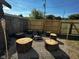 Backyard fire pit area circled by unique tree stump seating, offering a cozy and inviting outdoor space at 426 St Paul St, Indianapolis, IN 46201