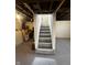Unfinished basement with stairs to main floor at 426 St Paul St, Indianapolis, IN 46201