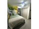 Cozy bedroom showcasing a waterfall-themed mural wall, enhancing the room's tranquil atmosphere and aesthetic appeal at 426 St Paul St, Indianapolis, IN 46201