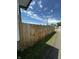View of the wooden backyard fence bordering a grassy area along the side of the property at 426 St Paul St, Indianapolis, IN 46201