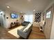 Cozy living room with hardwood floors, comfortable seating, and a modern entertainment center at 426 St Paul St, Indianapolis, IN 46201
