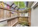 Unique backyard design with wooden fence, Aloha decor, and a covered area at 5002 Broadway St, Indianapolis, IN 46205