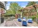 Beautiful backyard with wooden deck, brick chimney, pergola, and seating at 5002 Broadway St, Indianapolis, IN 46205