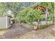 Backyard with a patio, shed, decorative trees, and custom metal water troughs at 5002 Broadway St, Indianapolis, IN 46205