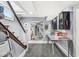 Basement featuring carpeted floors, work table, and access to the stairs to the upper level at 5002 Broadway St, Indianapolis, IN 46205