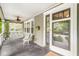 Spacious covered front porch with a swing, rocking chair, and access to the home's entrance at 5002 Broadway St, Indianapolis, IN 46205