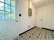 Mud Room features new door, graphic flooring, and neutral wall color at 503 Elmhurst Pl, Whiteland, IN 46184