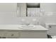 Bathroom featuring a tiled wall and vanity with sink at 5038 Allisonville Rd # E, Indianapolis, IN 46205