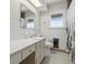 Bathroom with window, vanity, and tiled flooring at 5038 Allisonville Rd # E, Indianapolis, IN 46205