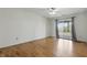 Bedroom with hardwood flooring and access to outdoor balcony at 5038 Allisonville Rd # E, Indianapolis, IN 46205
