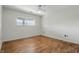 Bedroom with hardwood flooring, ceiling fan, and natural light at 5038 Allisonville Rd # E, Indianapolis, IN 46205