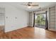 Bedroom with a ceiling fan and sliding glass doors at 5038 Allisonville Rd # E, Indianapolis, IN 46205