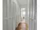 Hallway with closet space leading to the bathroom at 5038 Allisonville Rd # E, Indianapolis, IN 46205